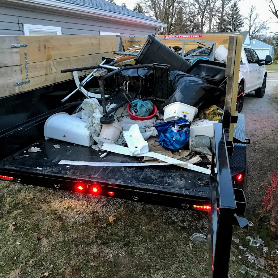 Roll-off dumpster delivered to a residential driveway in Troy
